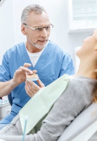 Dentist talking to dental patient