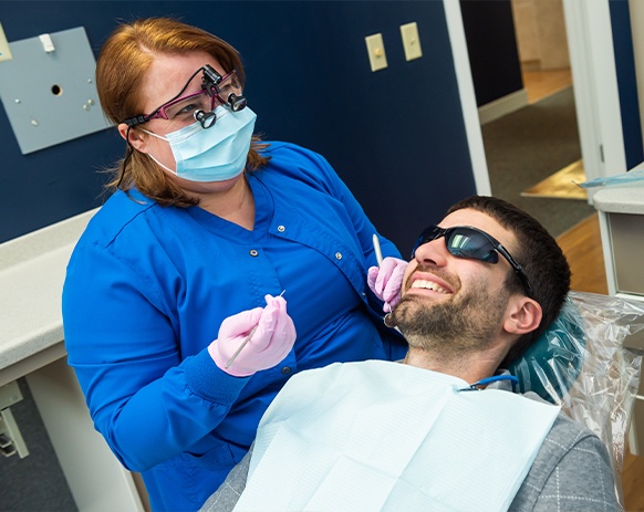 Relaxed dental patient in dental treatment chair