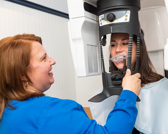 Dental patient receiving C B C T cone beam digital x ray scans