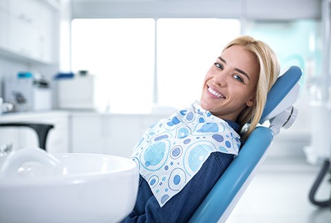 Smiling woman sitting in dental office