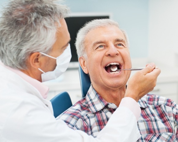 Dentist providing dental checkup and teeth cleaning