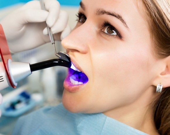 Dentisty patient receiving dental bonding