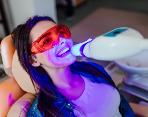 Dental patient receiving teeth whitening