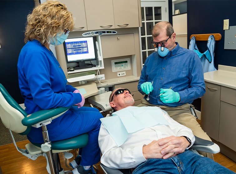 Dental patient smiling at his dentist in Lancaster