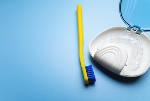 Clear aligner with toothbrush