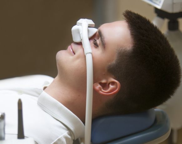 Relaxed dental patient receiving nitrous oxide dental sedation