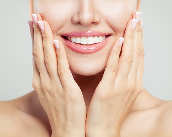 Close-up of woman’s smile with white teeth