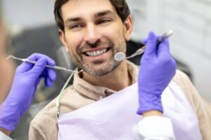 Man smiling during his dental cleaning