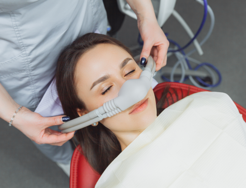 Woman undergoing dental sedation